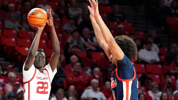 Oklahoma's Kuol Atak (22) shoots a 3-point basket over Ole Miss' Patton Pinkins (23) in the second half. Oklahoma's Kuol Atak (22) shoots a 3-point basket over Ole Miss' Patton Pinkins (23) in the second half.