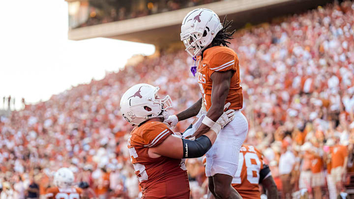 Texas Longhorns center Jake Majors (65) celebrates a touchdown my receiver Isaiah Bond (7) during the game against Mississippi State at Darrell K Royal-Texas Memorial Stadium in Austin Saturday, Sept. 28, 2024.