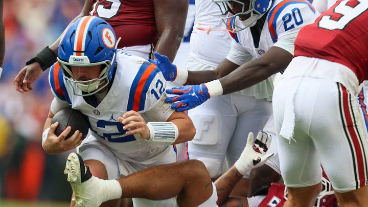 Florida quarterback Aaron Philo (12) runs against South Carolina during the first half of an NCAA football at Steve Spurrier Field at Ben Hill Griffin Stadium in Gainesville, FL on Saturday, October 10, 2026. [Alan Youngblood/Gainesville Sun]