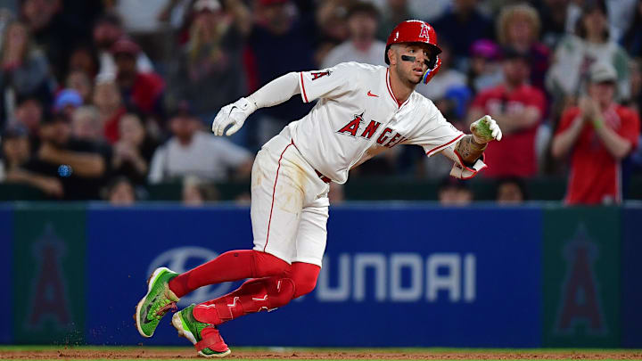 Jun 23, 2025; Anaheim, California, USA;  Los Angeles Angels shortstop Zach Neto (9) reaches first on a single against the Boston Red Sox during the eighth inning at Angel Stadium. Mandatory Credit: Gary A. Vasquez-Imagn Images
