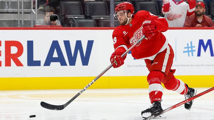 Oct 4, 2024; Detroit, Michigan, USA;  Detroit Red Wings left wing Carter Mazur (43) takes a shot in the second period against the Ottawa Senators at Little Caesars Arena. Mandatory Credit: Rick Osentoski-Imagn Images