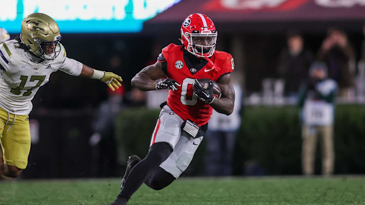 Nov 29, 2024; Athens, Georgia, USA; Georgia Bulldogs running back Roderick Robinson II (0) runs the ball against the Georgia Tech Yellow Jackets in the fourth quarter at Sanford Stadium. Mandatory Credit: Brett Davis-Imagn Images
Nov 29, 2024; Athens, Georgia, USA; Georgia Bulldogs running back Roderick Robinson II (0) runs the ball against the Georgia Tech Yellow Jackets in the fourth quarter at Sanford Stadium. Mandatory Credit: Brett Davis-Imagn Images