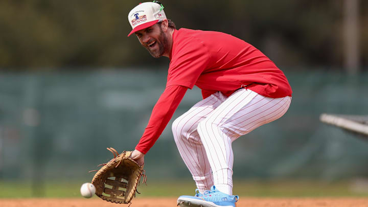 Philadelphia Phillies first base Bryce Harper (3) takes fielding practice during spring training workouts at BayCare Ballpark.