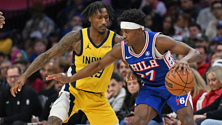 Jan 19, 2026; Philadelphia, Pennsylvania, USA; Philadelphia 76ers guard Vj Edgecombe (77) is defended by Indiana Pacers guard Quenton Jackson (29) during the second half at Xfinity Mobile Arena. Mandatory Credit: Eric Hartline-Imagn Images