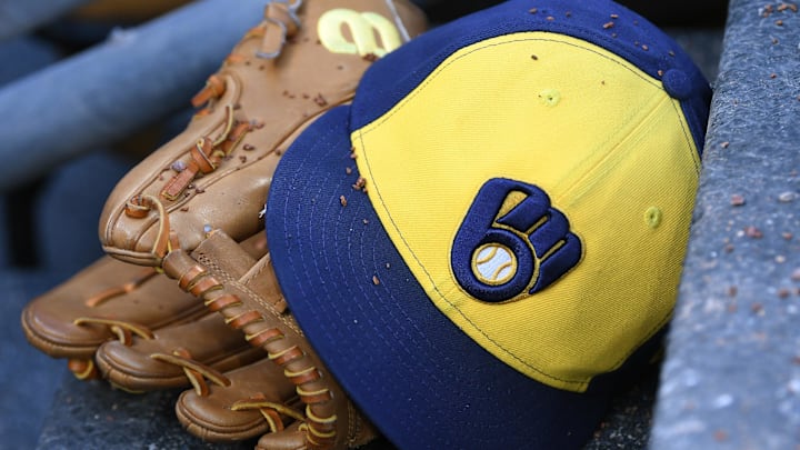 Apr 22, 2026; Detroit, Michigan, USA;  Milwaukee Brewers right fielder Sal Frelick (10) glove and hat sit on the Brewers dugout steps covered in infield dirt during their game against the Detroit Tigers at Comerica Park. Mandatory Credit: Lon Horwedel-Imagn Images