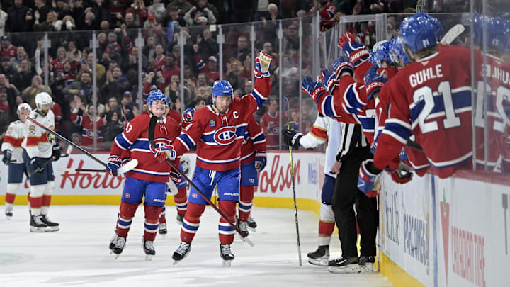Apr 1, 2025; Montreal, Quebec, CAN; Montreal Canadiens forward Nick Suzuki (14) celebrates with teammates after scoring a goal against the Florida Panthers during the third period at the Bell Centre. Mandatory Credit: Eric Bolte-Imagn Images