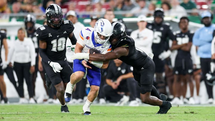 Boise State quarterback Maddux Madsen is brought down by South Florida linebacker Jhalyn Shuler. Boise State quarterback Maddux Madsen is brought down by South Florida linebacker Jhalyn Shuler.