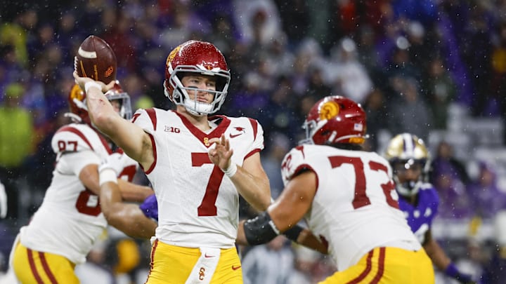 Nov 2, 2024; Seattle, Washington, USA; USC Trojans quarterback Miller Moss (7) passes against the Washington Huskies during the second quarter at Alaska Airlines Field at Husky Stadium. Mandatory Credit: Joe Nicholson-Imagn Images