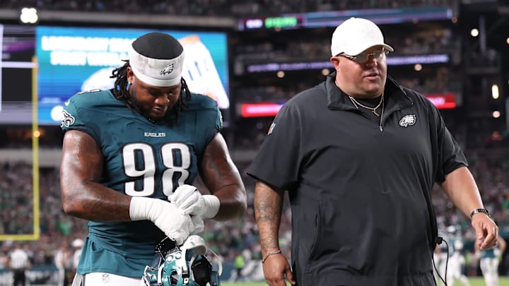 Sep 4, 2025; Philadelphia, Pennsylvania, USA; Philadelphia Eagles defensive tackle Jalen Carter (98) walks off the field with Eagles chief security officer Dom DiSandro (R) after being ejected from the game against the Dallas Cowboys at Lincoln Financial Field. Mandatory Credit: Bill Streicher-Imagn Images