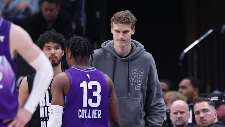 Feb 24, 2025; Salt Lake City, Utah, USA; Utah Jazz forward Lauri Markkanen (right) slaps hands with guard Isaiah Collier (13) during the second half of the game against the Portland Trail Blazers at Delta Center. Mandatory Credit: Rob Gray-Imagn Images