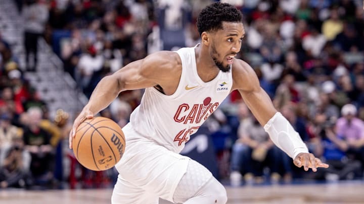 Mar 13, 2024; New Orleans, Louisiana, USA; Cleveland Cavaliers guard Donovan Mitchell (45) dribbles against the New Orleans Pelicans during the first half at Smoothie King Center.