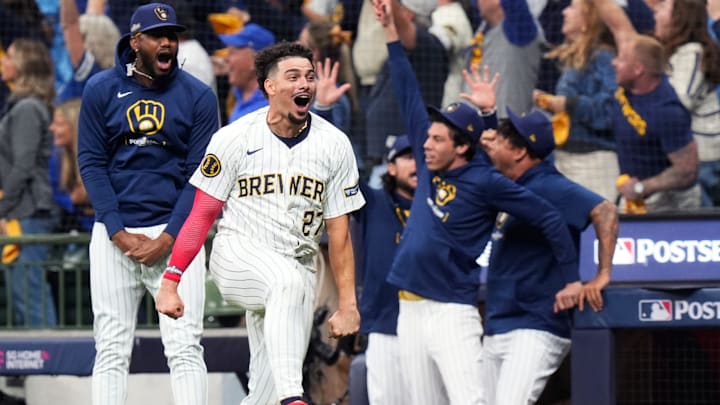 Milwaukee Brewers shortstop Willy Adames (27) reacts to Milwaukee Brewers right fielder Sal Frelick’s (10) homer (1) on a fly ball to right field during the seventh inning of Game 3 of National League wild-card series against the New York Mets on Thursday October 3, 2024 at American Family Field in Milwaukee, Wis.