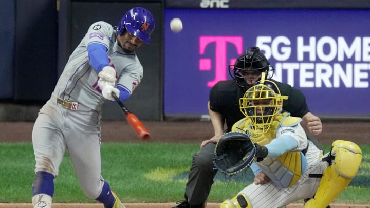 New York Mets shortstop Francisco Lindor (12) hits a sacrifice fly during the second inning of their wild-card playoff game against the Milwaukee Brewers Wednesday, October 2, 2024 at American Family Field in Milwaukee, Wisconsin.