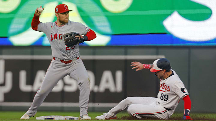 Sep 11, 2024; Minneapolis, Minnesota, USA; Los Angeles Angels second baseman Brandon Drury (23) forces out Minnesota Twins center fielder DaShawn Keirsey Jr. (89) and turns a double play in the fourth inning at Target Field. Mandatory Credit: Bruce Kluckhohn-Imagn Images