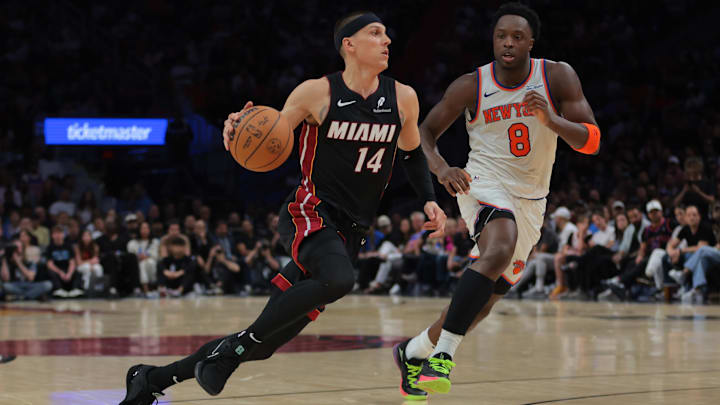 Mar 2, 2025; Miami, Florida, USA; Miami Heat guard Tyler Herro (14) drives to the basket past New York Knicks forward OG Anunoby (8) during the fourth quarter at Kaseya Center. Mandatory Credit: Sam Navarro-Imagn Images