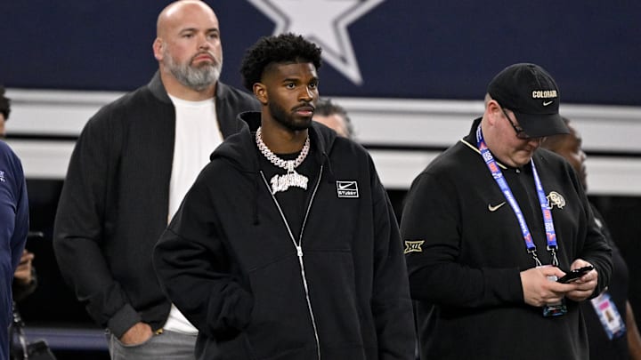West quarterback Shedeur Sanders of Colorado (2) looks on from the sidelines during the first half against the East at AT&T Stadium.
