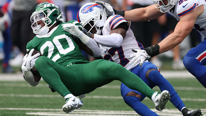 Sep 14, 2025; East Rutherford, New Jersey, USA; Buffalo Bills cornerback Tre'Davious White (27) tackles New York Jets running back Breece Hall (20) during the first half at MetLife Stadium.
