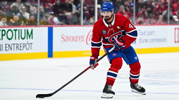 Sep 19, 2026; Montreal, Quebec, CAN;  Montreal Canadiens Alexandre Carrier defenseman (45) plays the puck against the Toronto Maple Leafs during overtime at Bell Centre.  Mandatory Credit: David Kirouac-Imagn Images