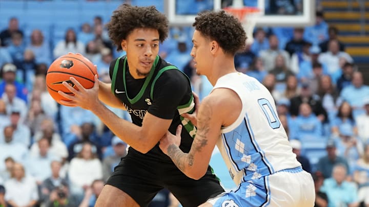 Dec 13, 2025; Chapel Hill, North Carolina, USA; USC Upstate Spartans guard Karmani Gregory (1) with the ball as North Carolina Tar Heels guard Kyan Evans (0) defends in the first half at Dean E. Smith Center. Mandatory Credit: Bob Donnan-Imagn Images Dec 13, 2025; Chapel Hill, North Carolina, USA; USC Upstate Spartans guard Karmani Gregory (1) with the ball as North Carolina Tar Heels guard Kyan Evans (0) defends in the first half at Dean E. Smith Center. Mandatory Credit: Bob Donnan-Imagn Images