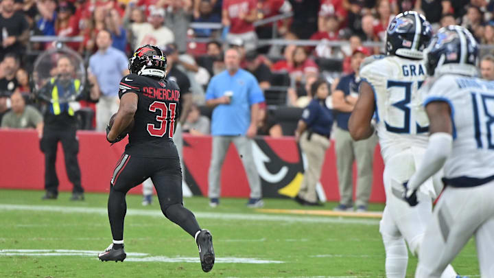 Oct 5, 2025; Glendale, Arizona, USA; Arizona Cardinals running back Emari Demercado (31) runs the ball for 71 yards before fumbling against the Tennessee Titans during the fourth quarter at State Farm Stadium. Mandatory Credit: Matt Kartozian-Imagn Images