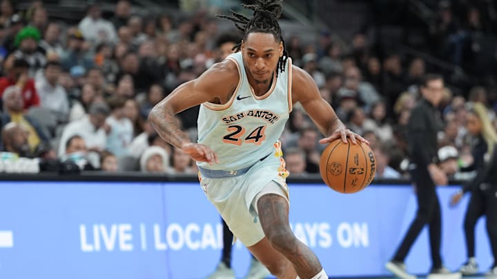 Dec 19, 2024; San Antonio, Texas, USA;  San Antonio Spurs guard Devin Vassell (24) dribbles to the basket in the first half against the Atlanta Hawks at Frost Bank Center. Mandatory Credit: Daniel Dunn-Imagn Images
