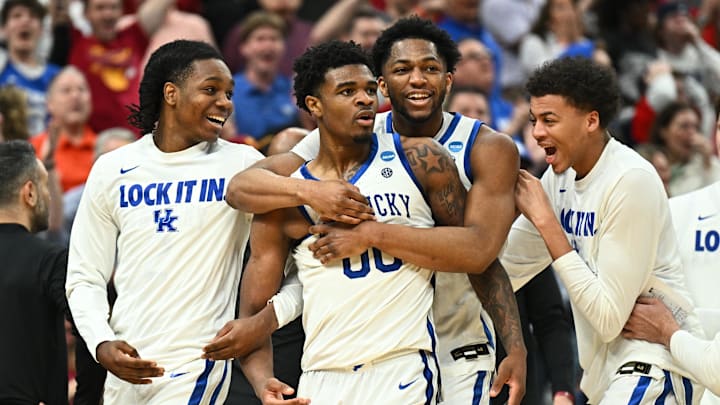 Mar 20, 2026; St. Louis, MO, USA; Kentucky Wildcats guard Otega Oweh (00) celebrates with teammates after shooting a three point basket to tie the game against the Santa Clara Broncos as time expired in the second half of a first round game of the men's 2026 NCAA Tournament at Enterprise Center. Mandatory Credit: Jeff Le-Imagn Images Mar 20, 2026; St. Louis, MO, USA; Kentucky Wildcats guard Otega Oweh (00) celebrates with teammates after shooting a three point basket to tie the game against the Santa Clara Broncos as time expired in the second half of a first round game of the men's 2026 NCAA Tournament at Enterprise Center. Mandatory Credit: Jeff Le-Imagn Images