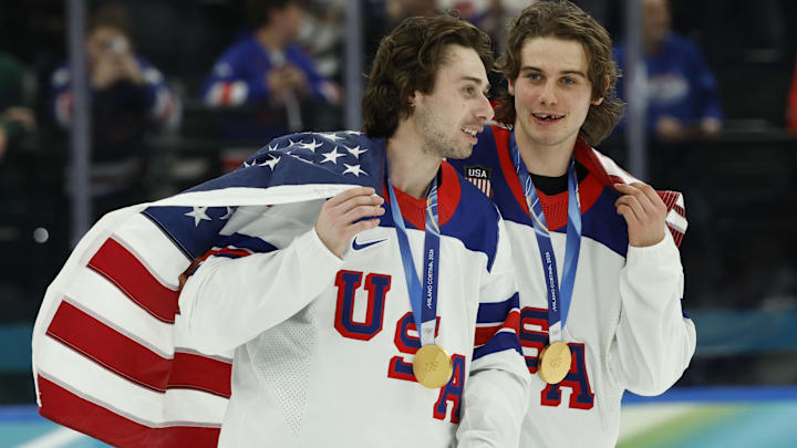 Quinn Hughes (43) and Jack Hughes (86) of the United States celebrate after defeating Canada: Geoff Burke-Imagn Images