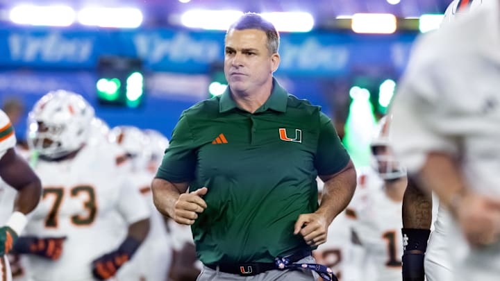 Jan 8, 2026; Glendale, AZ, USA; Miami Hurricanes head coach Mario Cristobal against the Mississippi Rebels during the 2026 Fiesta Bowl and semifinal game of the College Football Playoff at State Farm Stadium. Mandatory Credit: Mark J. Rebilas-Imagn Images Jan 8, 2026; Glendale, AZ, USA; Miami Hurricanes head coach Mario Cristobal against the Mississippi Rebels during the 2026 Fiesta Bowl and semifinal game of the College Football Playoff at State Farm Stadium. Mandatory Credit: Mark J. Rebilas-Imagn Images