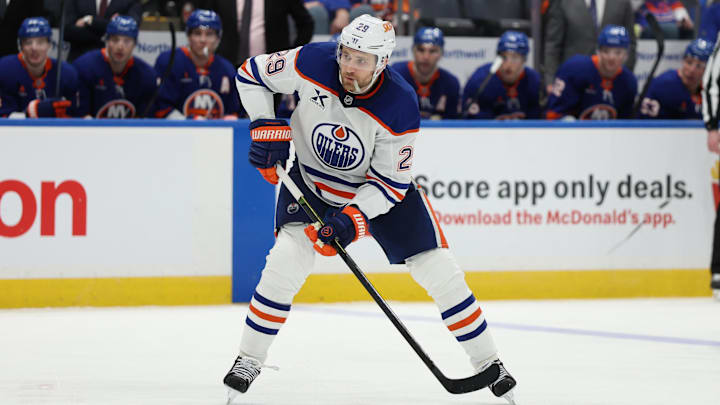 Mar 14, 2025; Elmont, New York, USA; Edmonton Oilers center Leon Draisaitl (29) controls the puck against the New York Islanders during the third period at UBS Arena. Mandatory Credit: Thomas Salus-Imagn Images