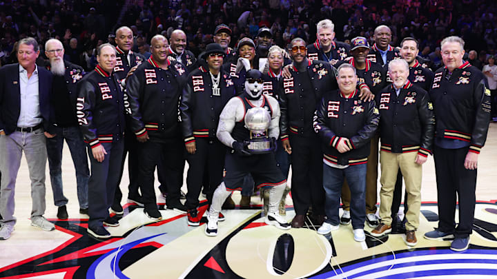 Jan 31, 2026; Philadelphia, Pennsylvania, USA; Hall of fame member Allen Iverson poses with his 2001 Philadelphia 76ers 2001 finals team during a ceremony at halftime against the New Orleans Pelicans at Xfinity Mobile Arena. Mandatory Credit: Bill Streicher-Imagn Images