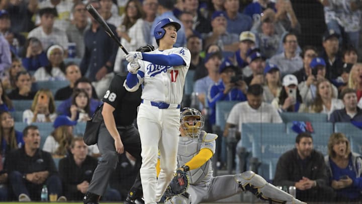 Oct 17, 2025; Los Angeles, California, USA; Los Angeles Dodgers two-way player Shohei Ohtani (17) hits a solo home run against the Milwaukee Brewers during the seventh inning of game four of the NLCS round for the 2025 MLB playoffs at Dodger Stadium. Mandatory Credit: Jayne Kamin-Oncea-Imagn Images