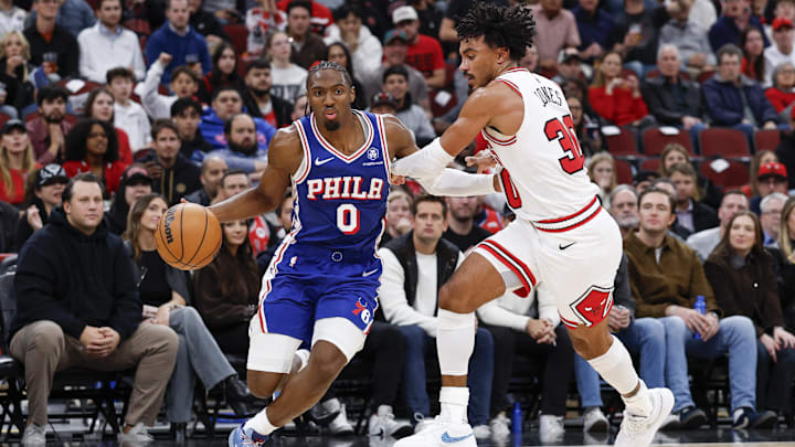 Nov 4, 2025; Chicago, Illinois, USA; Philadelphia 76ers guard Tyrese Maxey (0) drives to the basket against Chicago Bulls guard Tre Jones (30) during the second half at United Center. Mandatory Credit: Kamil Krzaczynski-Imagn Images