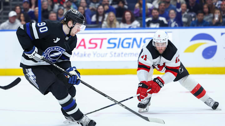 JJ Moser (#90) battling Stefan Noesen (#11) during the Lightning and Devils game
