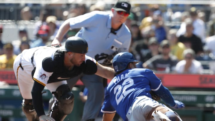 Pittsburgh Pirates catcher Joey Bart (14) tags Kansas City Royals outfielder Tommy Pham (22) out at home plate attempting to score a run during the third inning at PNC Park. 