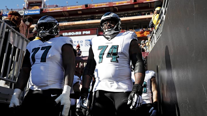 Dec 22, 2024; Landover, Maryland, USA; Philadelphia Eagles offensive tackle Mekhi Becton (77) and offensive tackle Fred Johnson (74) wait to take the field before the game against the Washington Commanders at Northwest Stadium. Mandatory Credit: Peter Casey-Imagn Images