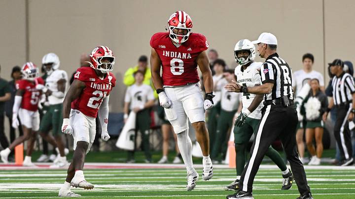 Oct 18, 2025; Bloomington, Indiana, USA; Indiana Hoosiers linebacker Rolijah Hardy (21) and defensive lineman Stephen Daley (8) celebrate after a defensive play during the second half against the Michigan State Spartans at Memorial Stadium. Mandatory Credit: Robert Goddin-Imagn Images