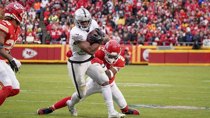 Dec 25, 2023; Kansas City, Missouri, USA; Las Vegas Raiders running back Zamir White (35) runs the ball as Kansas City Chiefs safety Mike Edwards (21) makes the tackle during the second half at GEHA Field at Arrowhead Stadium. Mandatory Credit: Denny Medley-USA TODAY Sports Dec 25, 2023; Kansas City, Missouri, USA; Las Vegas Raiders running back Zamir White (35) runs the ball as Kansas City Chiefs safety Mike Edwards (21) makes the tackle during the second half at GEHA Field at Arrowhead Stadium. Mandatory Credit: Denny Medley-USA TODAY Sports