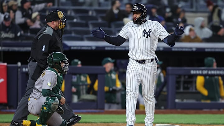 New York Yankees third baseman Amed Rosario hits a three run home run in the eighth inning against the Athletics at Yankee Stadium.