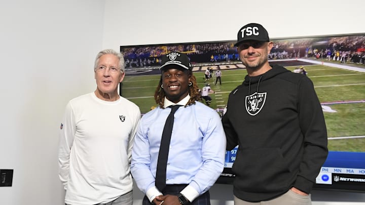 Apr 25, 2025; Henderson, NV, USA; (L-R) Las Vegas Raiders head coach Pete Carroll, Ashton Jeanty and general manager John Spytek pose after a news conference introducing Jeanty as the first round draft pick in the 2025 NFL Draft at Intermountain Health Performance Center. Mandatory Credit: Candice Ward-Imagn Images