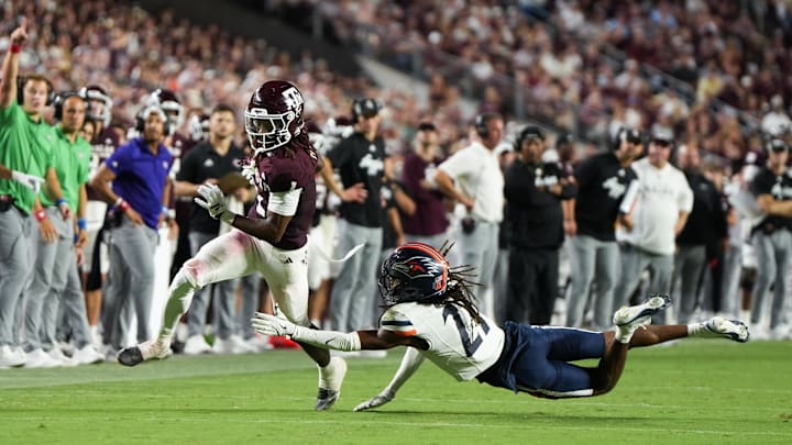 Aug 30, 2025; College Station, Texas, USA; Texas A&M Aggies wide receiver Mario Craver (1) escapes a tackle from UTSA Roadrunners safety Brandon Jacob Jr. (21) in the second half against the UTSA Roadrunners at Kyle Field. Mandatory Credit: Sean Thomas-Imagn Images