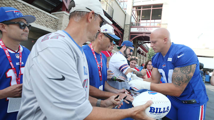Bills defensive edge Landon Jackson signs autographs for fans during the second day of Buffalo Bills training camp at St. John Fisher University Thursday, July 24, 2025.