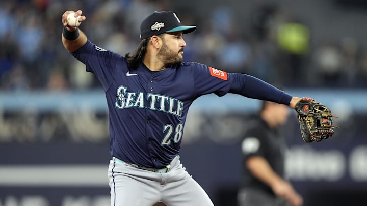 Oct 20, 2025; Toronto, Ontario, CAN; Seattle Mariners third baseman Eugenio Suarez (28) throws out Toronto Blue Jays right fielder George Springer (4) at first base in the second inning during game seven of the ALCS round for the 2025 MLB playoffs at Rogers Centre. Mandatory Credit: John E. Sokolowski-Imagn Images