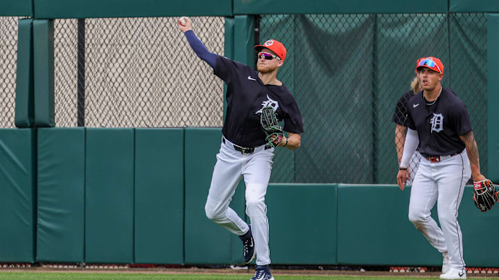 Feb 22, 2025; Lakeland, Florida, USA; Detroit Tigers outfielder Parker Meadows (22) throws to the infield during the third inning against the Philadelphia Phillies at Publix Field at Joker Marchant Stadium.