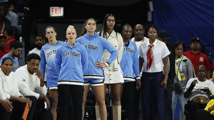 Aug 1, 2025; Chicago, Illinois, USA; Injured Chicago Sky forward Angel Reese (C) looks on from the bench during the first half of a WNBA game against the Golden State Valkyries at Wintrust Arena. Mandatory Credit: Kamil Krzaczynski-Imagn Images