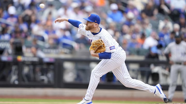 Jun 1, 2025; New York City, New York, USA; New York Mets pitcher Reed Garrett (75) delivers a pitch against the Colorado Rockies during the eighth inning at Citi Field. Mandatory Credit: Gregory Fisher-Imagn Images