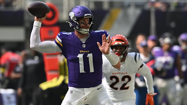 Sep 21, 2025; Minneapolis, Minnesota, USA; Minnesota Vikings quarterback Carson Wentz (11) throws downfield against the Cincinnati Bengals during the first half at U.S. Bank Stadium. Mandatory Credit: Jeffrey Becker-Imagn Images