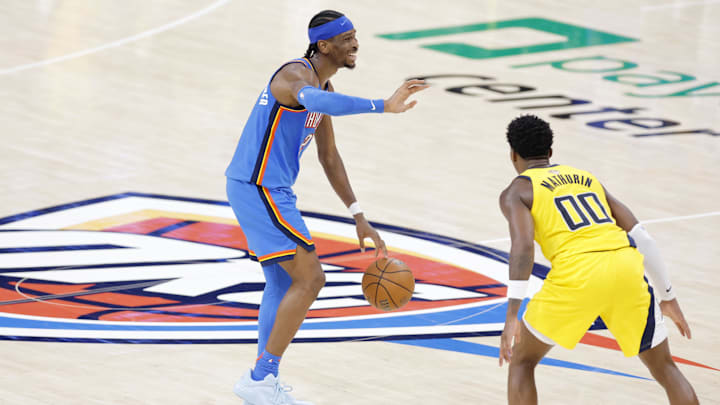 Jun 22, 2025; Oklahoma City, Oklahoma, USA; Oklahoma City Thunder guard Shai Gilgeous-Alexander (2) dribbles the ball against Indiana Pacers guard Bennedict Mathurin (00) during the second half of game seven of the 2025 NBA Finals at Paycom Center. Mandatory Credit: Alonzo Adams-Imagn Images