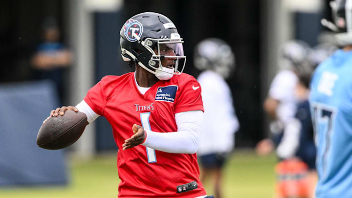 May 10, 2025; Nashville, TN, USA;  Tennessee Titans quarterback Cam Ward (1) throws a pass as he goes through drills during Rookie Mini Camp at Saint Thomas Sports Park. Mandatory Credit: Steve Roberts-Imagn Images