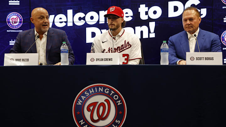 Jul 22, 2023; Washington, District of Columbia, USA; Washington Nationals president of baseball operations and general manager Mike Rizzo (L), Nationals first round draft pick outfielder Dylan Crews (M), and agent Scott Boras (R) at an introductory press conference prior to the Nationals' game against the San Francisco Giants at Nationals Park. 