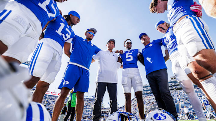 BYU wide receivers with coach Fesi Sitake ahead of home game against Arizona